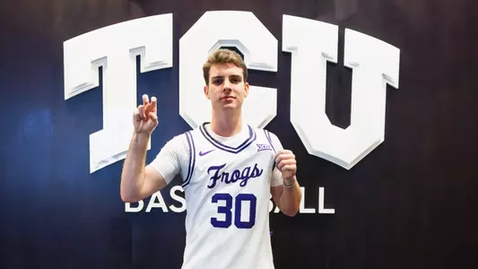 Gavin Murphy, wearing a white jersey, poses for the camera.