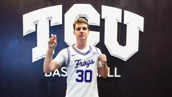 Gavin Murphy, wearing a white jersey, poses for the camera.