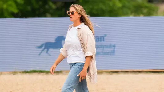 TCU Equestrian Assistant Courtney Line walking