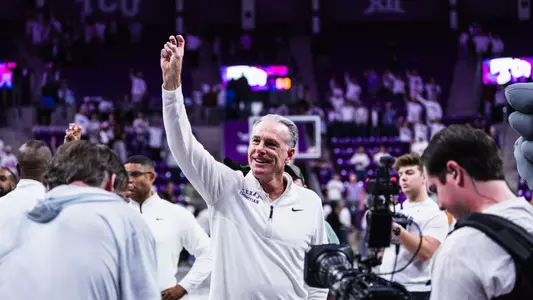 jamie dixon with his right hand frogs up