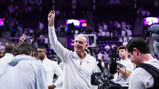 jamie dixon with his right hand frogs up