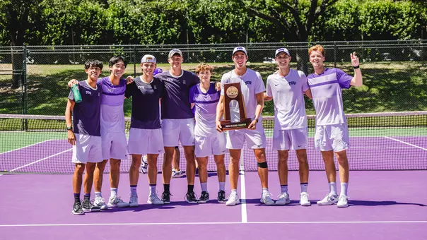 The TCU Men's Tennis team gathers with the NCAA Super Regional trophy following a 4-0 victory over Stanford.