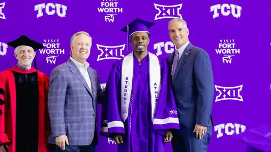 Jayden Pierre is shown with cap and gown at graduation