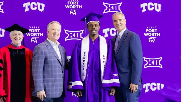 Jayden Pierre is shown with cap and gown at graduation