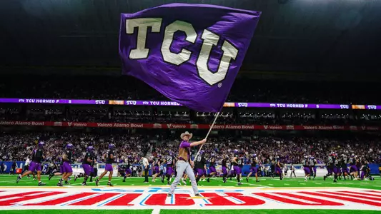 A TCU Ranger waves a TCU flag pregame at the Alamo Bowl