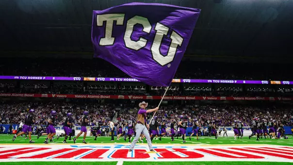 A TCU Ranger waves a TCU flag pregame at the Alamo Bowl