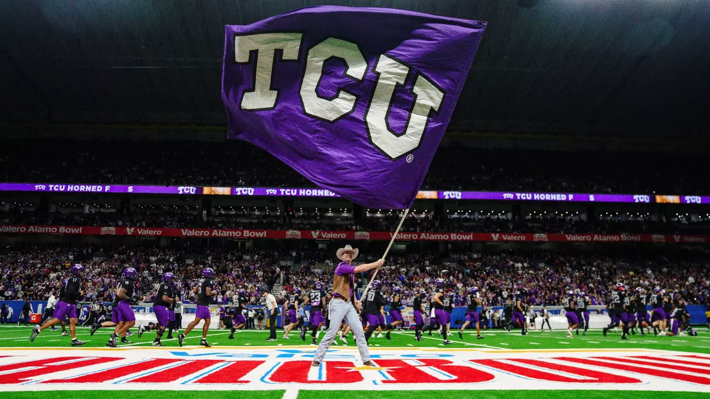 A TCU Ranger waves a TCU flag pregame at the Alamo Bowl