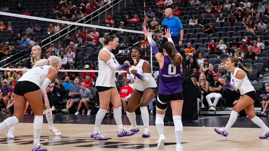 TCU volleyball's Kinsley Young and Reese Robins celebrate a point against UNLV