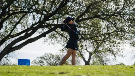 Gracie McGovern follows through on a tee shot.