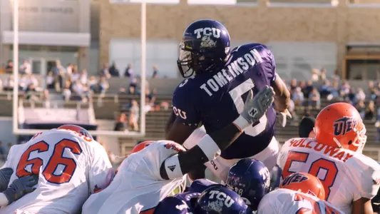 LaDainian Tomlinson diving over a pile of lineman