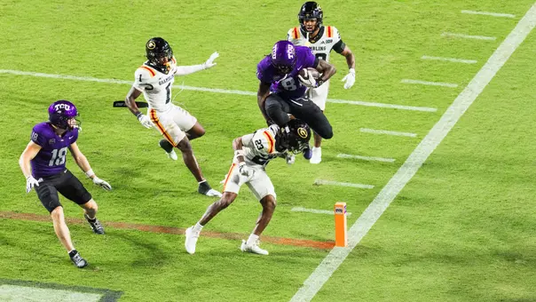 Kari Ashley hurdling a Grambling State player at the goal line