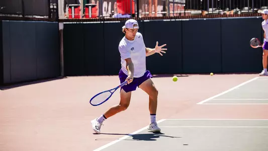 Albert Pedrico prepares to connect on a forehand wearing a white shirt