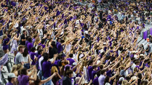 Fans cheering at Amon G. Carter Stadium