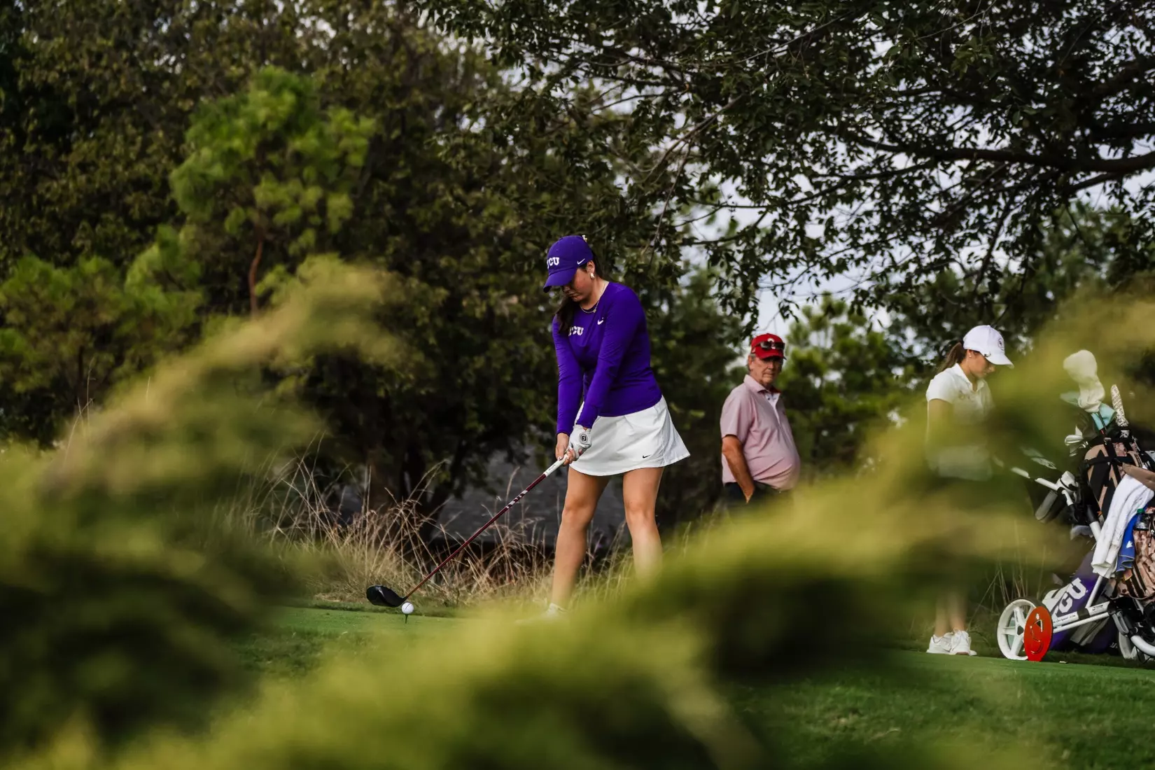 Gracie McGovern looks down at a golf ball