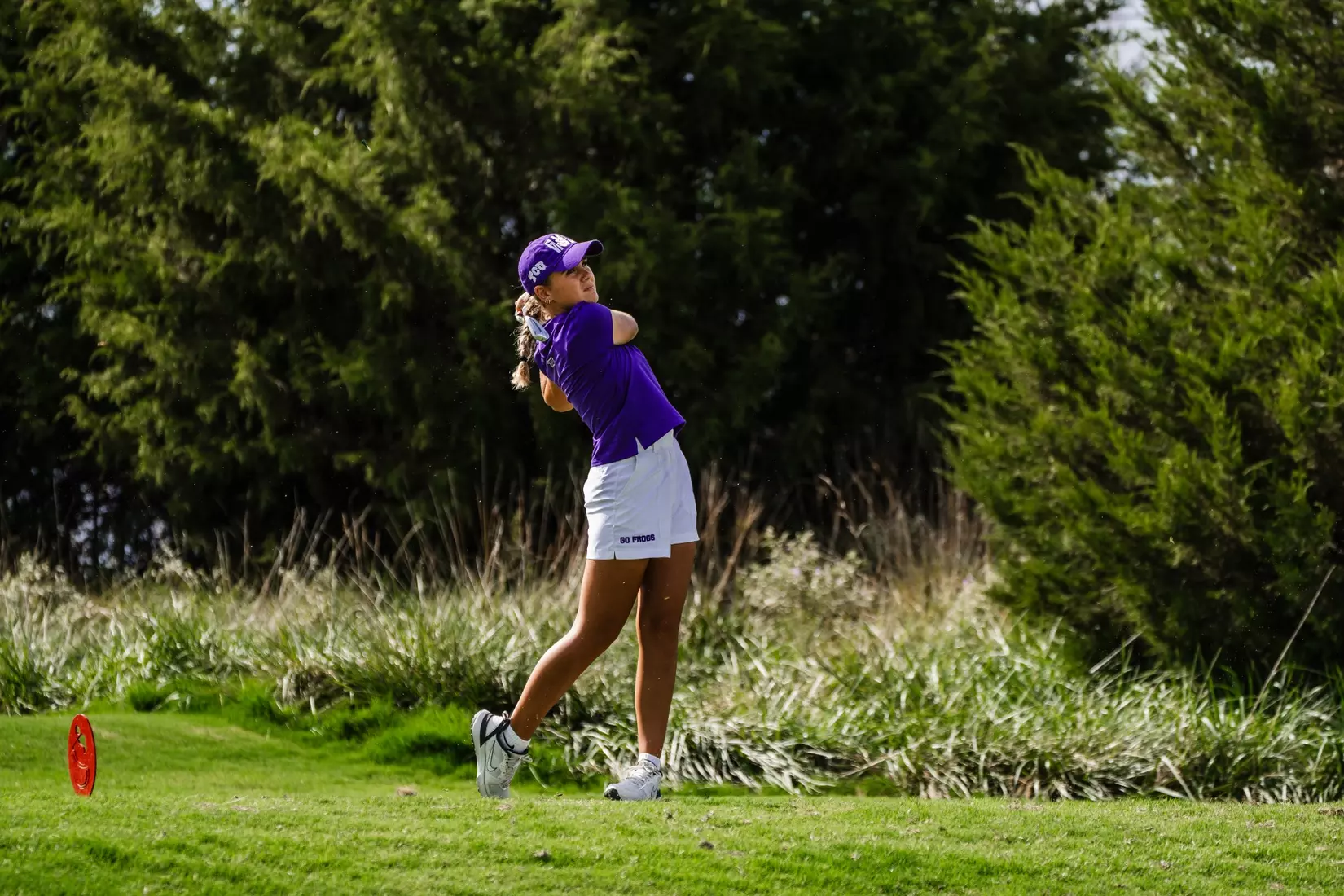 Camille Min-Gaultier follows through on a tee shot.