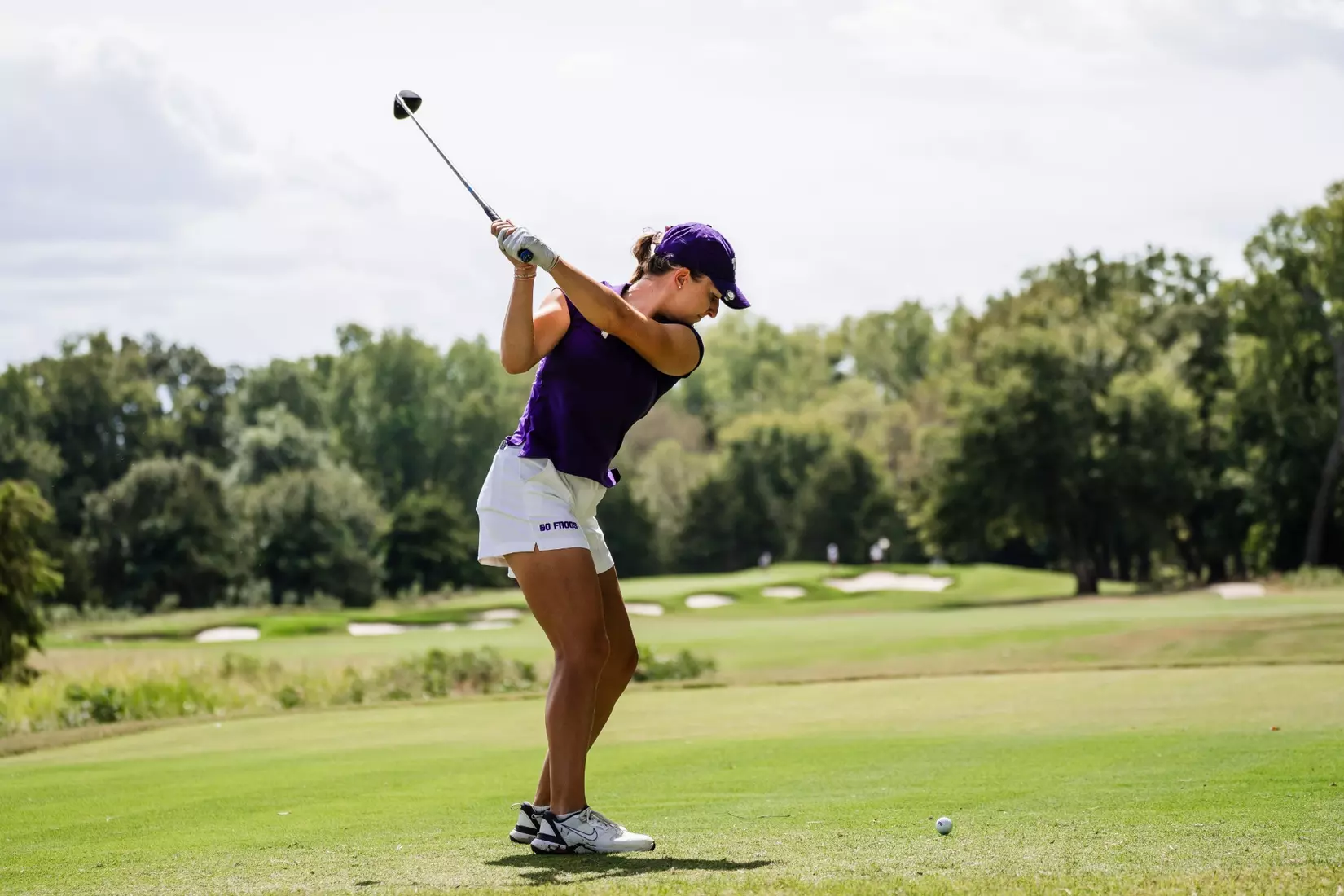 Sofie Dimitrova holds her back swing with a driver.
