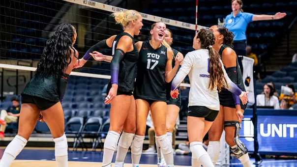 TCU Volleyball celebrates after scoring a point against WVU
