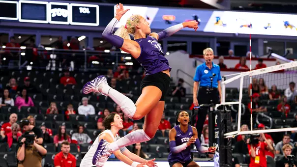 Becca Kelley jumps out of the back row to swing for a kill