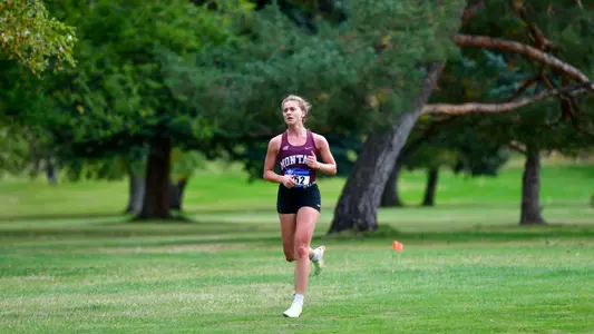 The Grizzlies run during a cross country meet at the University of Montana Golf Course in Missoula, Montana on September 30, 2022.