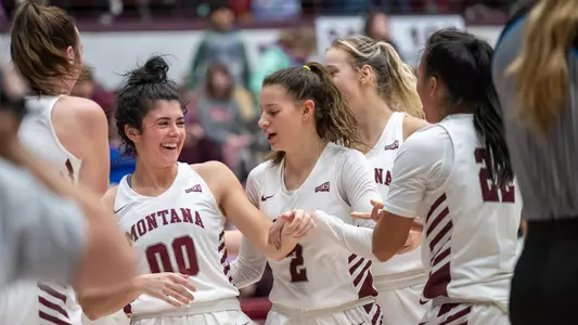 Sammy Fatkin #00 laughs as her teammates help her off the floor after being fouled during the fourth quarter against the Providence Friars at Dahlberg Arena on Tuesday, Nov. 15, 2022.
