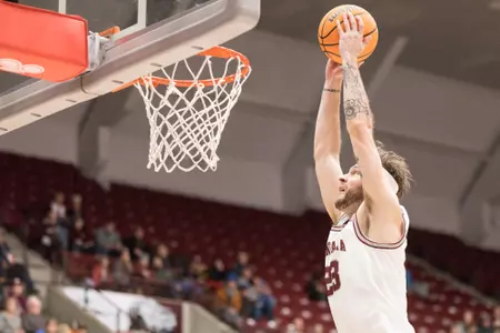 Montana Grizzlies forward Mack Anderson #23 dunks during a college basketball game against the Troy Trojans at Dahlberg Arena on November 19th, 2022 in Missoula, Montana.