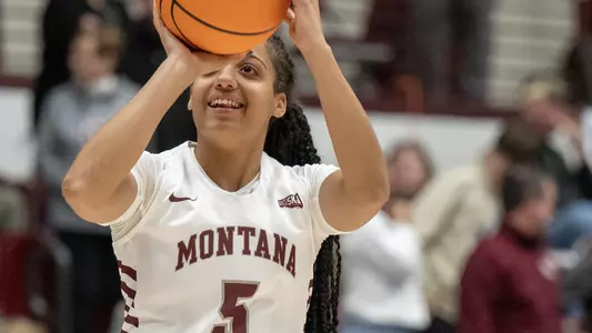 Lady Griz Katerina Tsineke #5 smiles while warming up with her teammates before playing North Dakota State at Dahlberg Arena on Monday, Nov. 7, 2022.