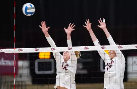 Montana Grizzlies Catie Semadeni #16 and Elise Jolly #17 defend the net during a match against Portland State on November 3, 2022.