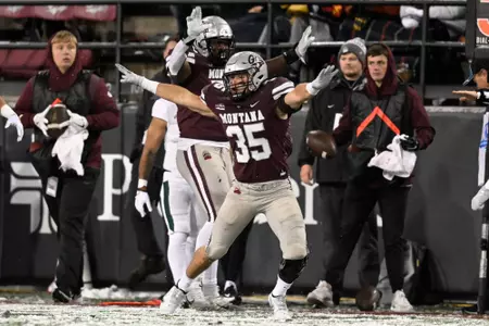 Braxton Hill #35 of the Montana Grizzlies celebrates a stop during a college football game against the Cal Poly Mustangs at Washington-Grizzly Stadium on November 5, 2022 in Missoula, Montana.