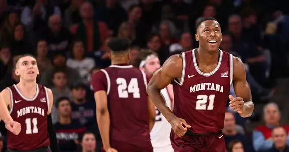 Laolu Oke #21 of the Montana Grizzlies smiles after scoring against Gonzaga Bulldogs at McCarthey Athletic Center on December 20, 2022 in Spokane, Washington.