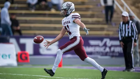 Patrick Rohrbach #41 of the Montana Grizzlies punts during a college football game against the Weber State Wildcats at Stewart Stadium in Ogden Utah on Oct. 22, 2022.
