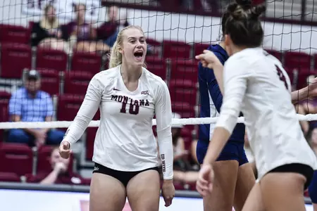 Ellie Scherffius #10 of the Montana Grizzlies reacts to a made point during a college volleyball game between the Montana Grizzlies and the UC Davis Aggies Dahlberg Arena on August 27, in Missoula, Montana.