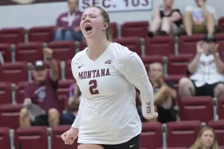 Paige Clark #2 of Montana Grizzlies celebrates during a college volleyball match against University of North Dakota on August 26, 2022.