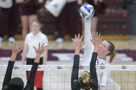 Paige Clark #2 of Montana Grizzlies spikes the ball during a college volleyball match against University of North Dakota on August 26, 2022.