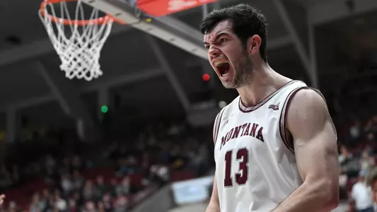 Josh Bannan #13 of the Montana Grizzlies reacts after an and-one during a college basketball game against the Weber State Wildcats at Dahlberg Arena on January 12, 2023 in Missoula, Montana.