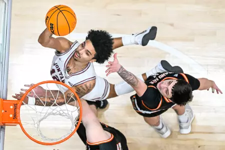 Brandon Whitney #12 of the Montana Grizzlies shoots a layup during a college basketball game against the Idaho State Bengals at Dahlberg Arena on January 14, 2023 in Missoula, Montana.