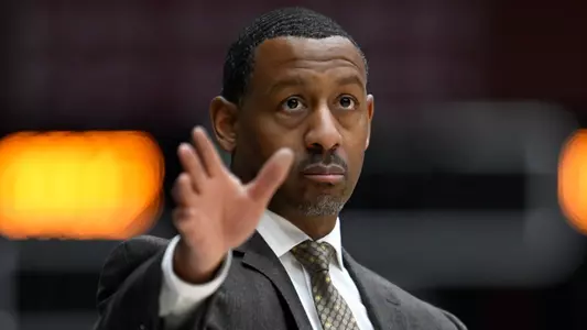 Head coach Travis DeCuire of the Montana Grizzlies looks on during a college basketball game against the Idaho State Bengals at Dahlberg Arena on January 14, 2023 in Missoula, Montana.