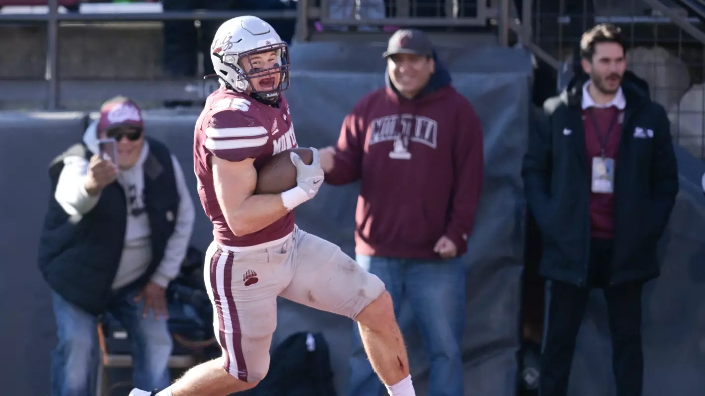 Braxton Hill #35 of the Montana Grizzlies reacts as he runs a interception back for a touchdown in the third quarter of game against the Northern Colorado Bears at Washington-Grizzly Stadium on October 28, 2023 in Missoula, Montana.