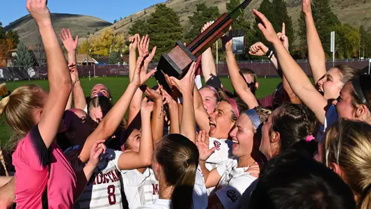 The Montana Grizzlies celebrate their win over  Sacramento State to clinch the Big Sky Conference at the South Campus Stadium on Thursday, Oct. 19, 2023.