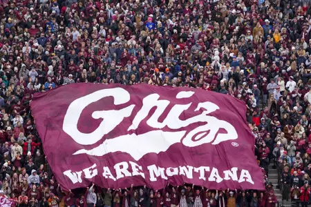 Fans fly the Grizzlies flag for the Brawl of the Wild football match at Washington-Grizzly Stadium on November 18, 2023 in Missoula, Montana.