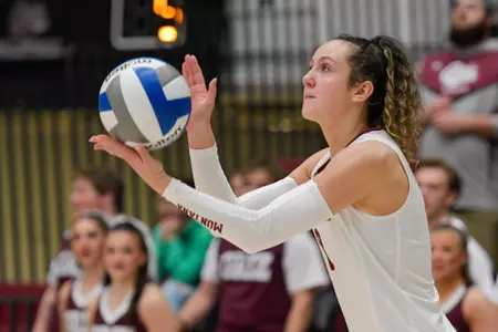 Maddie Pyles #8 of the Montana Grizzlies prepares to serve the ball during the fourth set of a college volleyball match between the Montana Grizzlies and the Northern Arizona Lumberjacks at Dahlberg Arena on November 2, 2023 in Missoula, Montana.