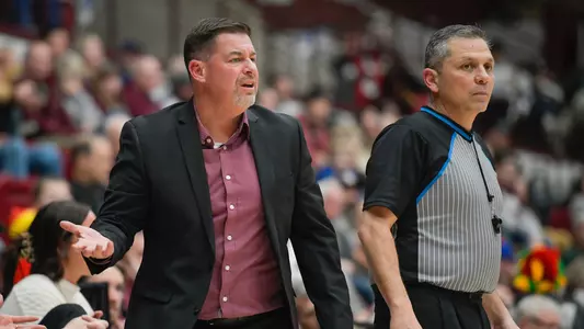 Head coach Brian Holsinger of the Montana Grizzlies expresses confusion on a foul call during the third quarter of a game against the Colorado State Rams at Robin Selvig Court inside Dahlberg Arena on December 9, 2023 in Missoula, Montana.
