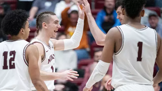 MISSOULA, MT - February 2: Aanen Moody #11 of the Montana Grizzlies celebrate with his teammates during a timeout during the second half against Northern Colorado at Dahlberg Arena on Thursday, February 2, 2023. (Photo by Ryan Brennecke/University of Montana/Getty Images)