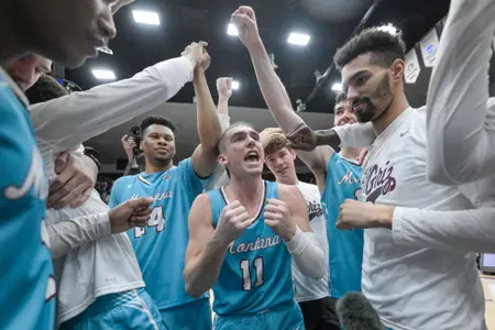 Aanen Moody #11 of the Montana Grizzlies talks to the team in a huddle after beating the Northern Arizona Lumberjacks 67-66 at Dahlberg Arena on February 4, 2023 in Missoula, Montana.