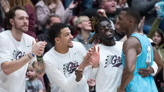 The University of Montana bench celebrates after scoring against Northern Arizona Lumberjacks at Dahlberg Arena on Saturday, February 4, 2023, in Missoula, Montana.