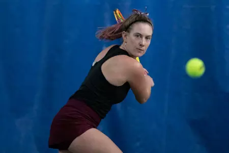 Maria Goheen prepares to hit the ball against the Idaho Vandals on March 23, 2023 at PEAK Fitness. The Grizzlies beat the Vandals 5-2.