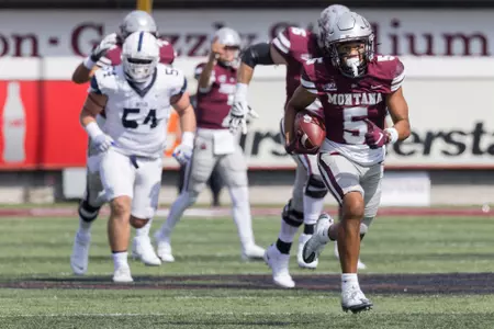Junior Bergen #5 rushes for a touchdown during a college football game against the Butler Bulldogs at Washington-Grizzly Stadium on September 2, 2023 in Missoula, Montana.
