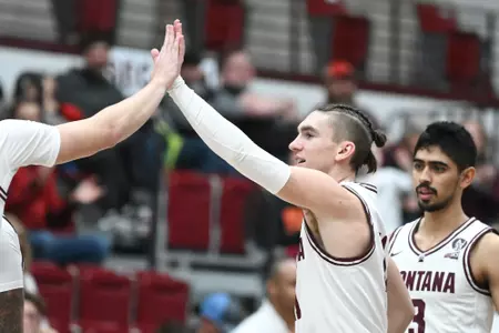 Aanen Moody #11 of the Montana Grizzlies reacts during a game against Northern Arizona University at Dahlberg Arena on January 13, 2023 in Missoula, Montana.