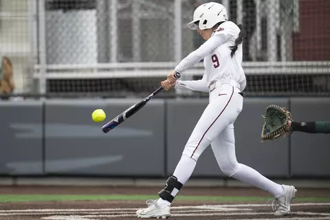 Elise Ontiveros #9 of the Montana Grizzlies connects with a pitch while playing against Sacramento State at the Montana Softball Complex on April 8, 2023 in Missoula, Montana.