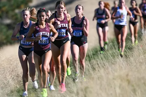 The Griz Cross Country prepares for their race during a cross country meet at the University of Montana Golf Course in Missoula, Montana on Friday, Sept. 15, 2023.