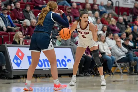 Mack Konig #2 of the Montana Grizzlies dribbles the ball during the first quarter of a game against the Dickinson State Blue Hawks at Robin Selvig Court inside Dahlberg Arena on November 27, 2023 in Missoula, Montana.